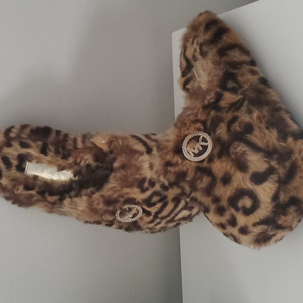 Michael Kors Leopard Fur House Slippers with MK embellishment.